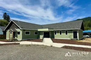 Re-Sided, Repaired & Repainted — a Deming Commercial Building in Sage Green — Deming, WA 98244
