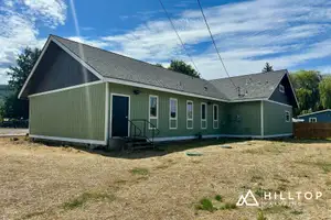 Re-Sided, Repaired & Repainted — a Deming Commercial Building in Sage Green — Deming, WA 98244