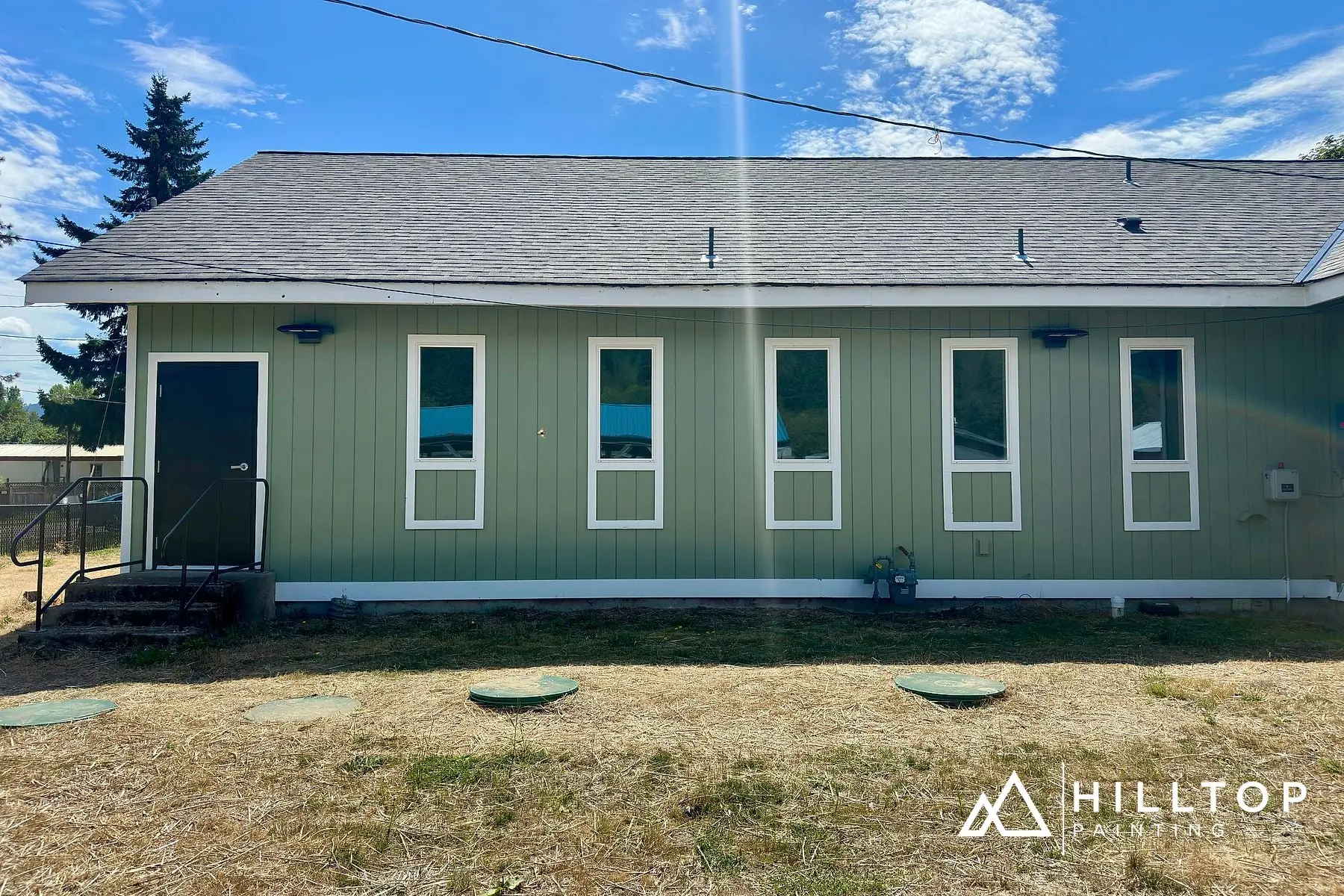 Re-Sided, Repaired & Repainted — a Deming Commercial Building in Sage Green — photo 3