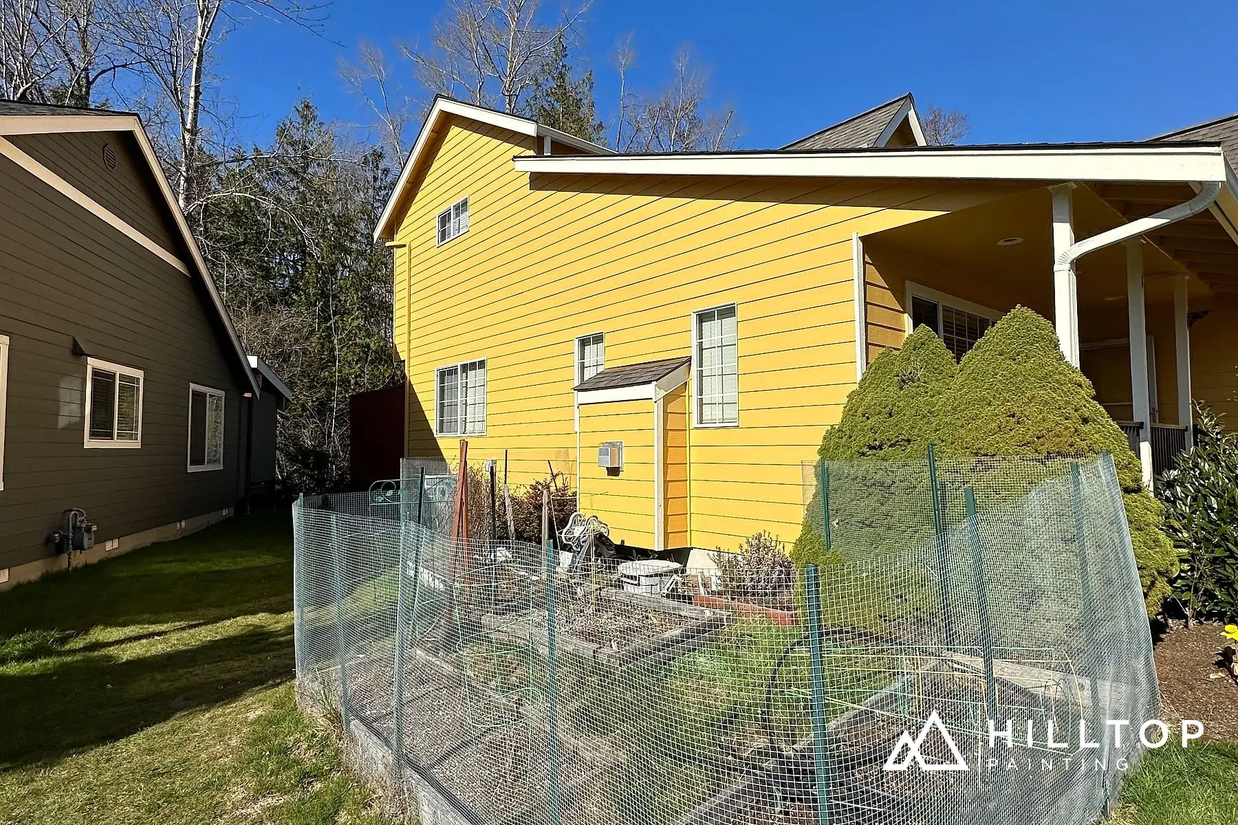 Butter-Yellow Kept Warm — a Bellingham Stone-Front Cottage & Its Garage Doors — photo 2
