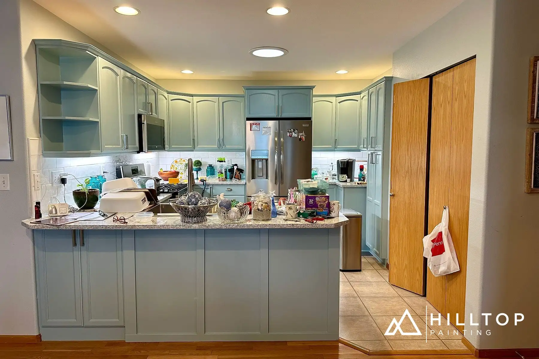 Golden Oak to a Soft Blue-Green — a 35-Door Bellingham Cabinet Repaint